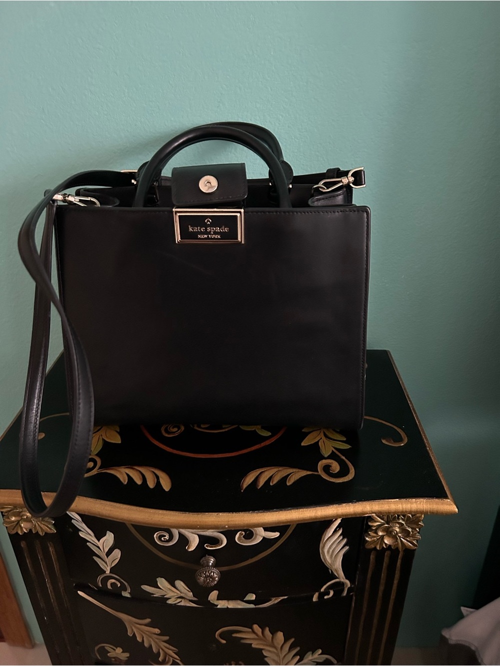 Kate spade black purse. Gold hardware inside zipper pocket decider. 10x8 inch.